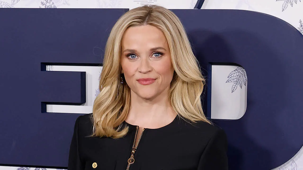 Reese Witherspoon clarifies she isn't being paid to endorse AI and stands by her post.
