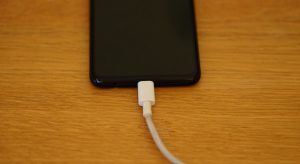 Research shows that charging your phone by your bed each night interferes with a sleep hormone linked to aging.