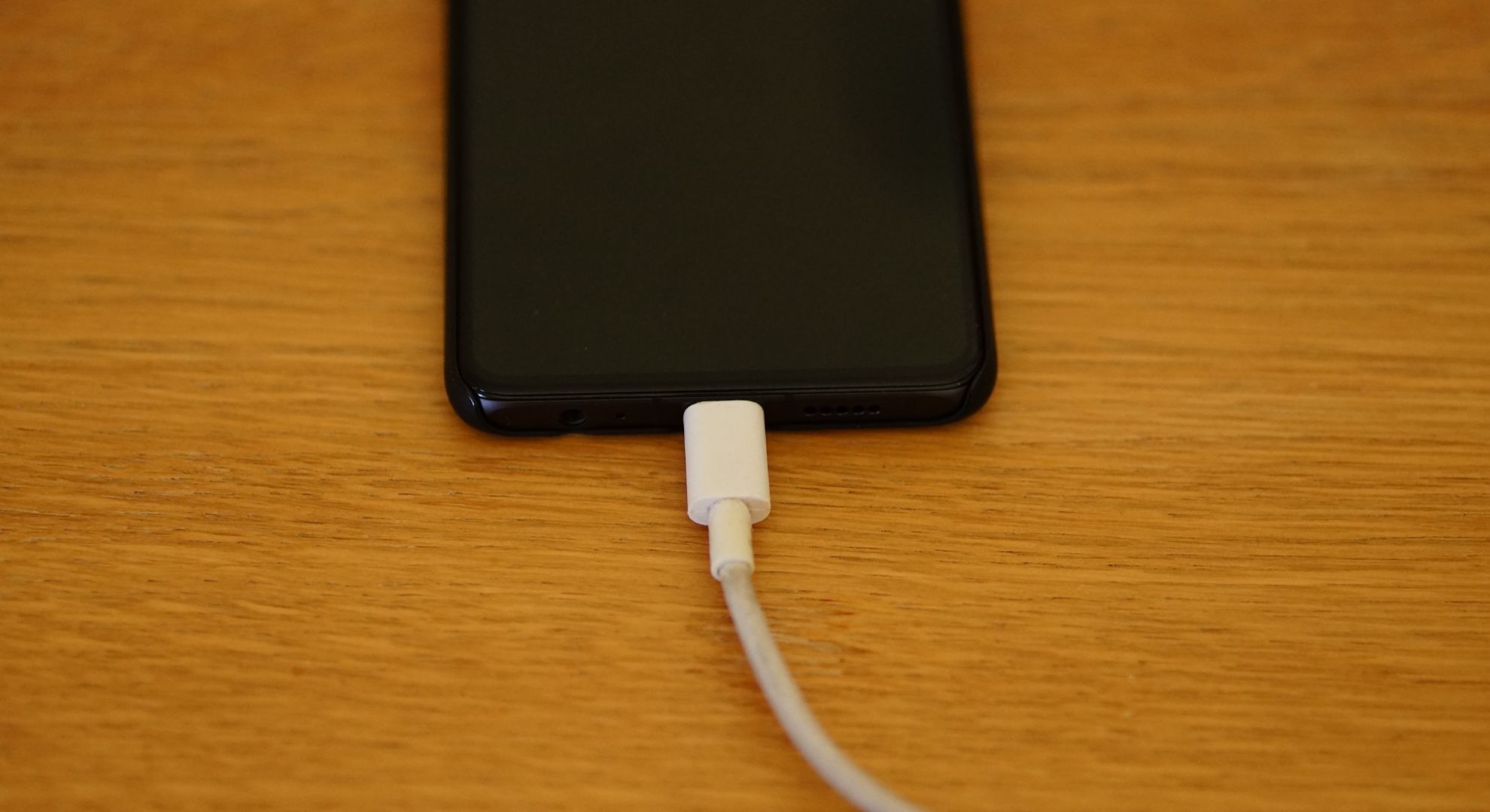 Research shows that charging your phone by your bed each night interferes with a sleep hormone linked to aging.