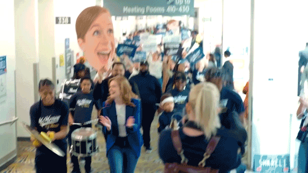 Senate hopeful McMorrow's arrival with a marching band sparks comparisons to Harris