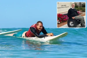 Surfer who is paralyzed gets back in the water on a modified board