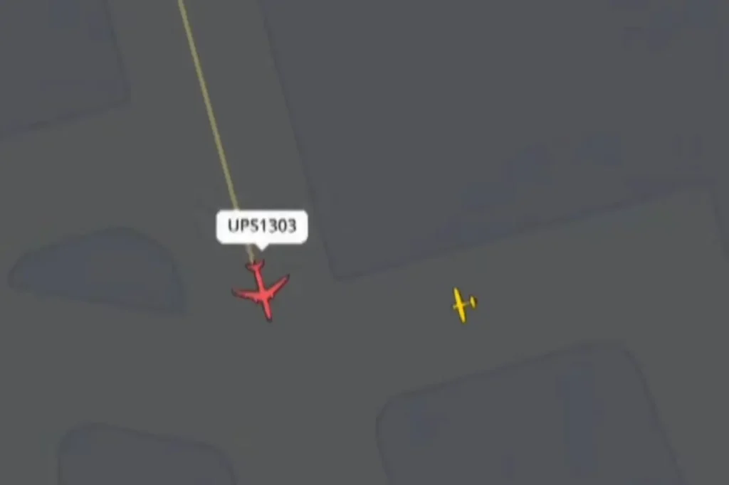 UPS plane nearly collides with another aircraft at Kentucky airport, where 14 lost their lives in a previous crash, as air traffic control exclaims: 'What are you doing?'