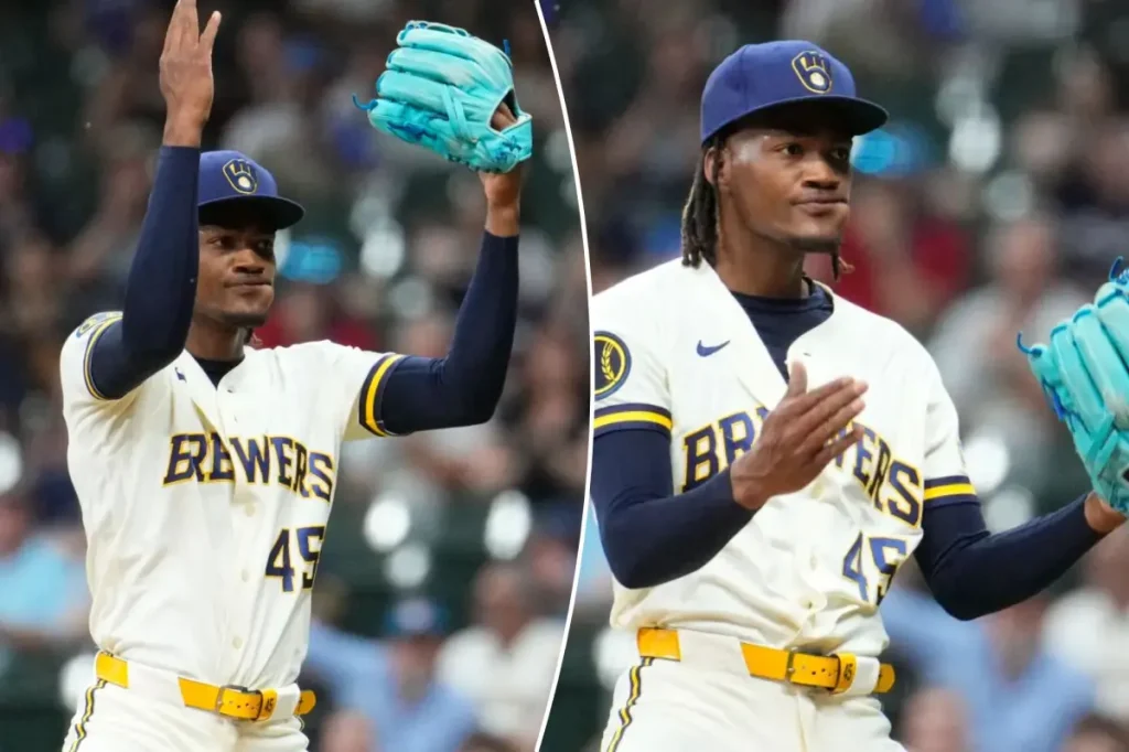 Abner Uribe of the Brewers performs a lively 'suck it' gesture at the Cardinals