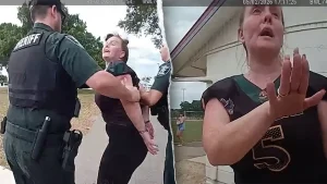 Bodycam footage shows the arrest of a mother accused of kicking her child at a football game.