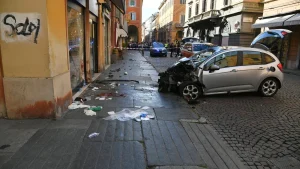 Car drives into crowd in Modena, Italy; driver with a knife attacks at least one person.