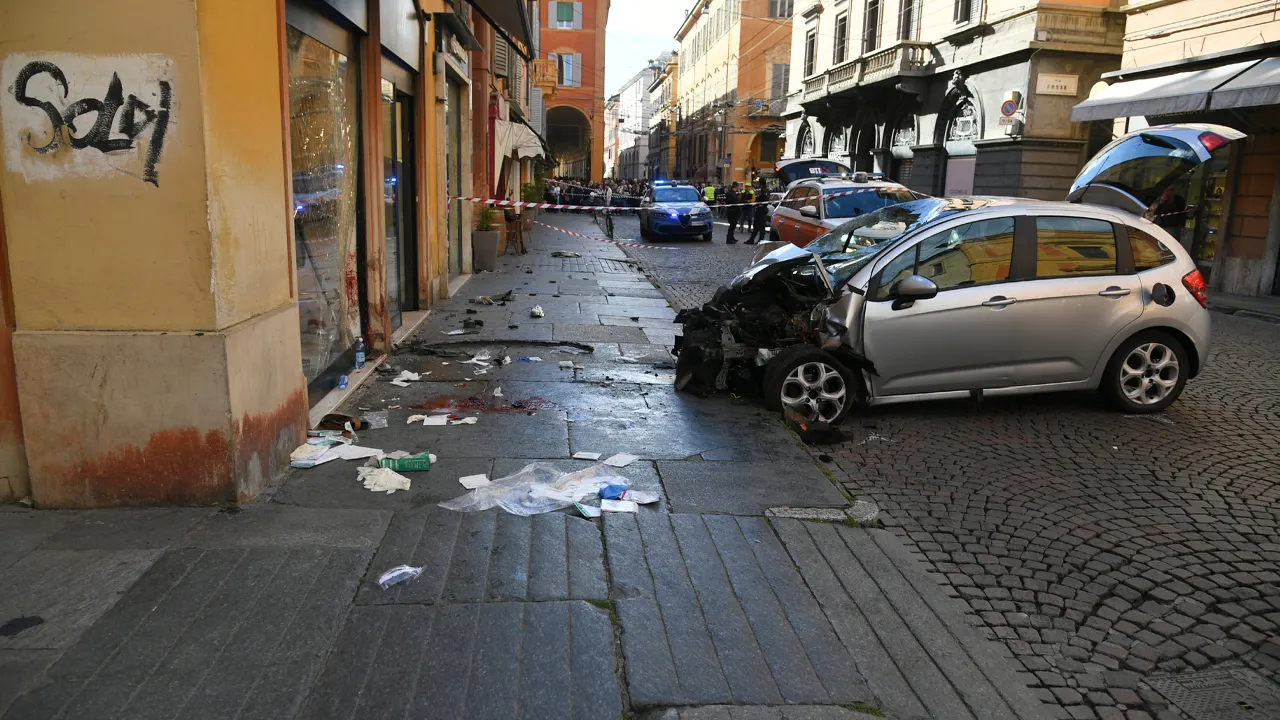 Car drives into crowd in Modena, Italy; driver with a knife attacks at least one person.