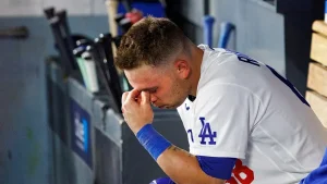 Dalton Rushing of the Dodgers hits his own head with his bat during a tough slump.