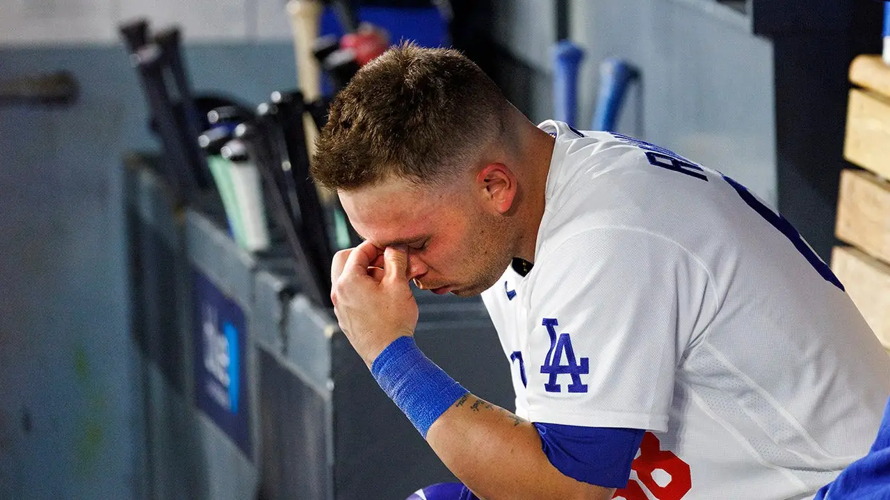 Dalton Rushing of the Dodgers hits his own head with his bat during a tough slump.