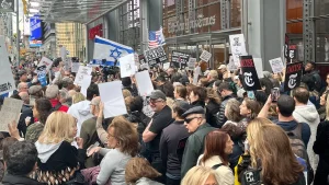 Demonstrators gather outside the New York Times, calling for Kristof's dismissal over article