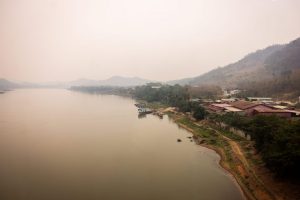 First of seven trapped miners rescued from flooded cave in Laos while search continues for two missing individuals