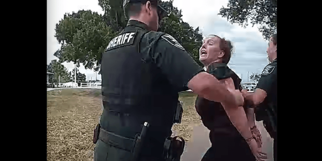 Florida mother charged with kicking a youth football player on the field; during her arrest, she allegedly yells, 'I'm the one who got hit!'