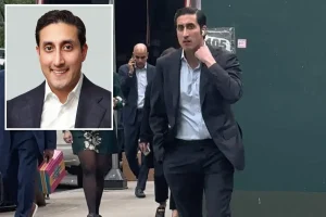 Former JPMorgan banker seen in NYC street-style video before strange sexual harassment allegations, while his father comments on the controversial lawsuit