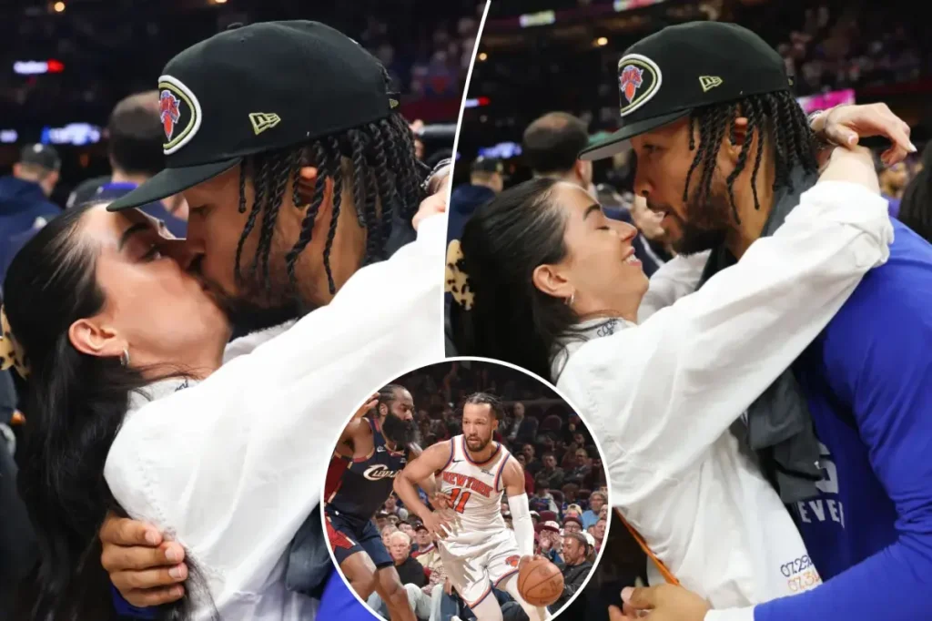 Jalen Brunson and his wife Ali celebrate with a kiss after being named MVP of the Eastern Conference finals.