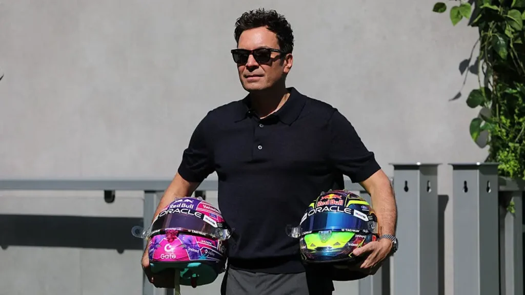 Jimmy Fallon awkwardly chews on a microphone during a strange interview before the F1 Miami event.