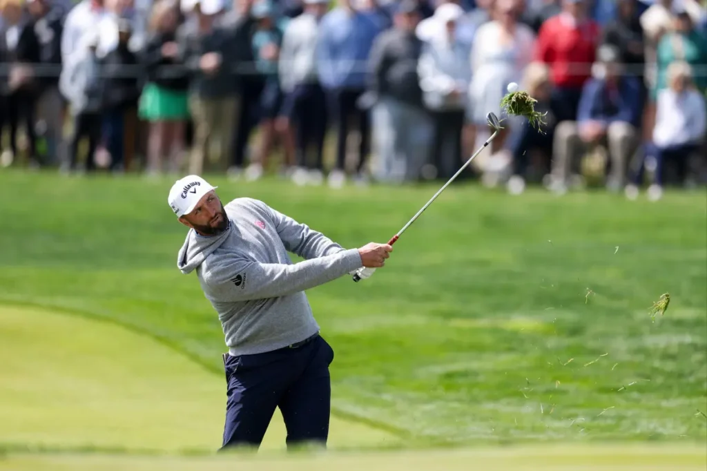 Jon Rahm strikes a PGA Championship volunteer with a divot