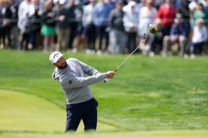 Jon Rahm strikes a PGA Championship volunteer with a divot