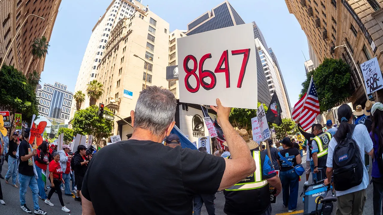 May Day demonstration: '86 47' signs appear after Comey's indictment
