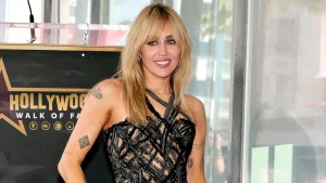 Miley Cyrus marks her Hollywood Walk of Fame star with a striking Versace outfit.