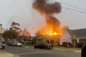 One person killed in tragic explosion at LA garage with fireworks visible in the sky