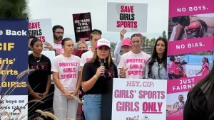 Protests break out at California girls' track event over dispute between the White House and Newsom's office regarding transgender issues.