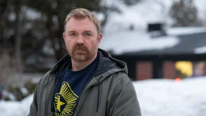 Senator Van Hollen supports Maine Senate candidate's Nazi tattoo, explaining it relates to PTSD.
