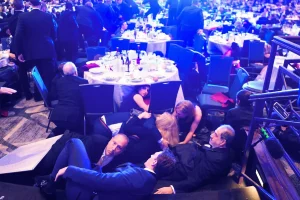 The shocking image that showed anxious dinner guests hiding and fearing a repeat of the Kennedy curse