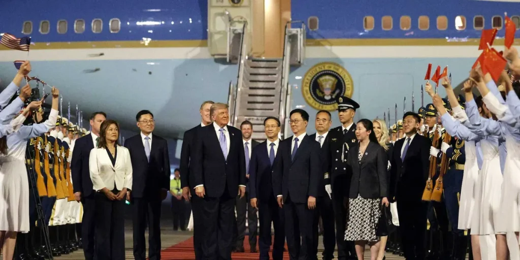 Trump visits China accompanied by a surprise guest and a group of business leaders.