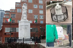 Vandals attach a toilet to the fallen Christopher Columbus statue while an activist expresses anger over the lack of inquiry: 'Obvious racism'
