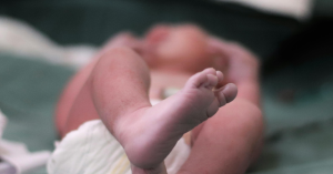 Woman Charged with Murder After Newborn Found Dead in Field