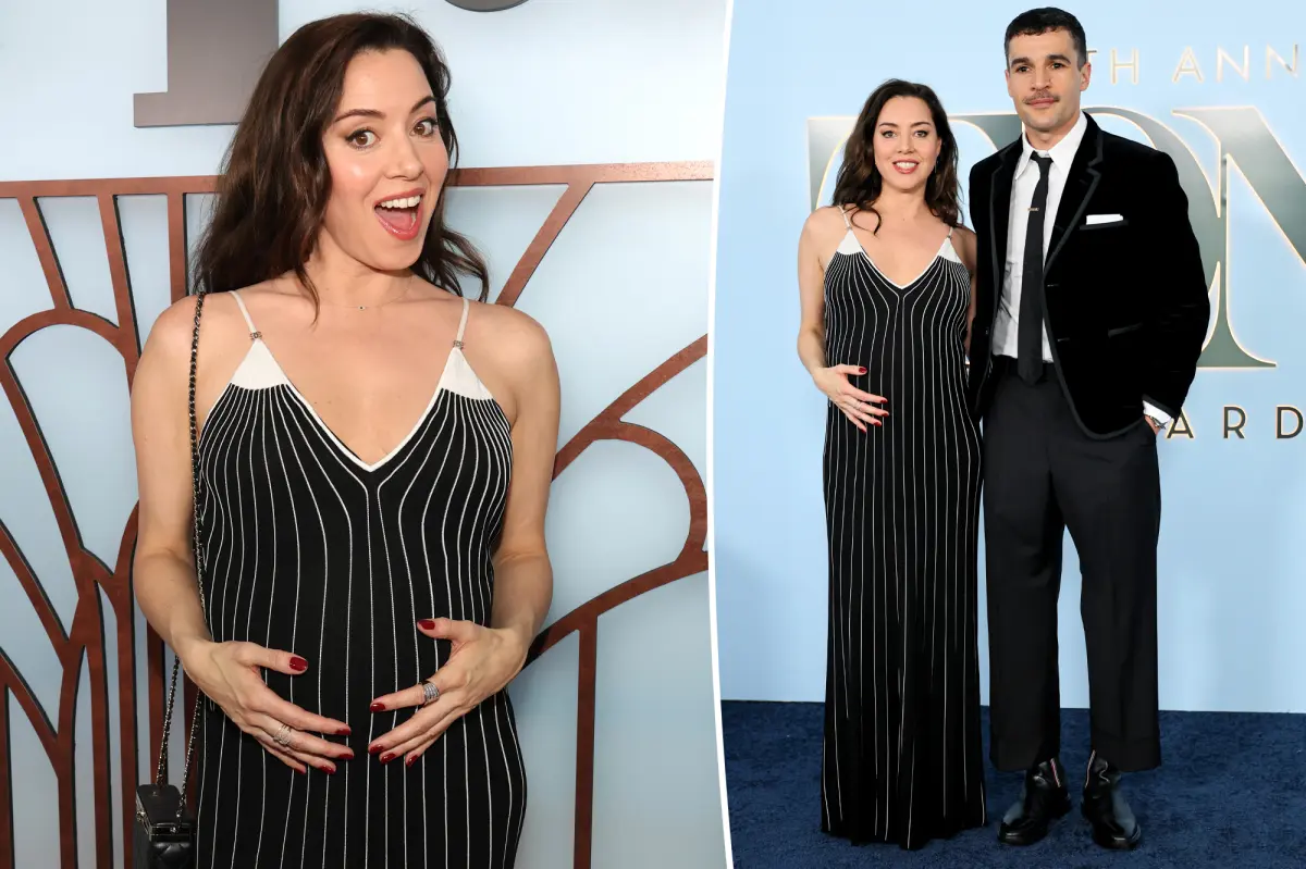 Aubrey Plaza holds her baby bump while cheering on partner Chris Abbott at the 2026 Tony Awards