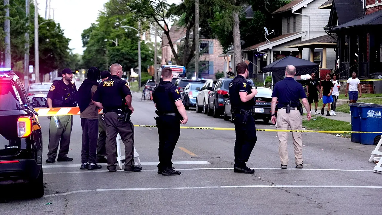 Authorities follow several leads after 12 people were shot at a street festival near Toledo.