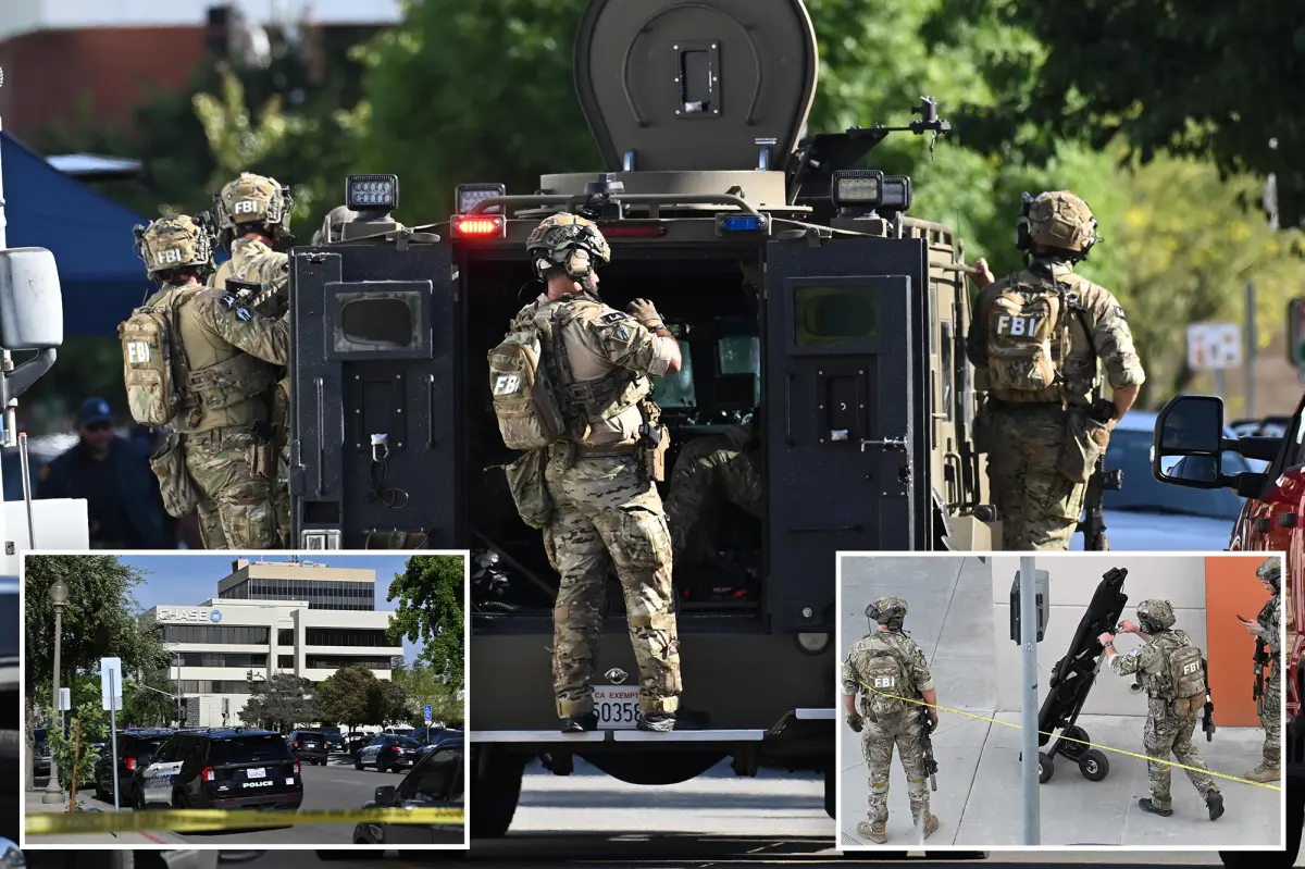 Bank robber 'wearing explosives' remains holed up with hostages