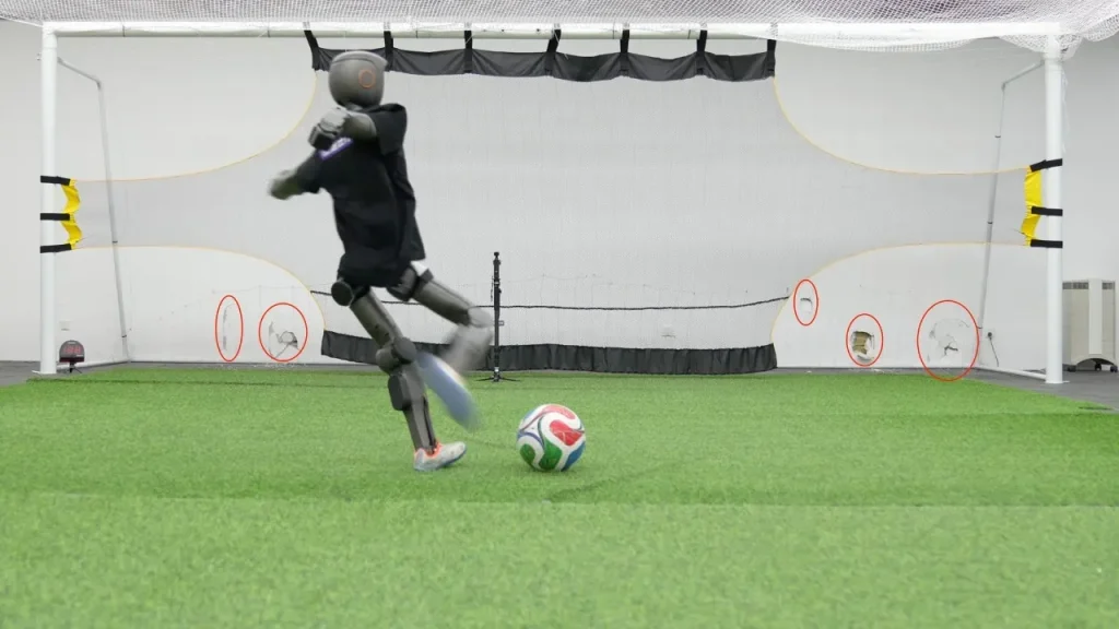 Booster Robotics T1 robot hits soccer balls with enough force to leave dents in walls