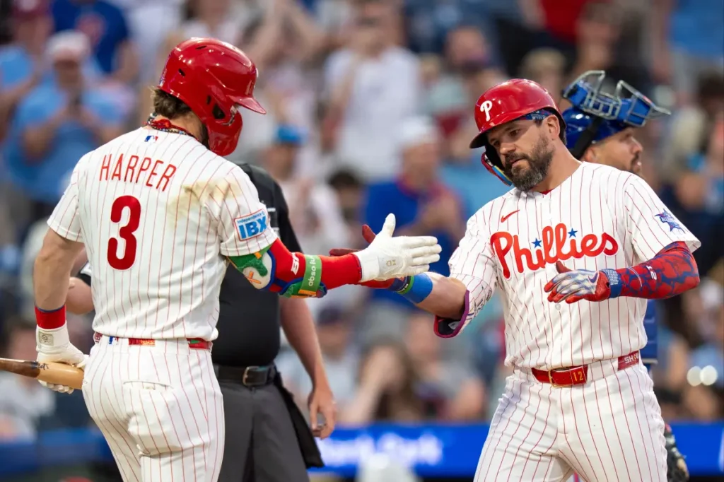 Bryce Harper and Kyle Schwarber achieve remarkable milestones in decisive victory against the Mets
