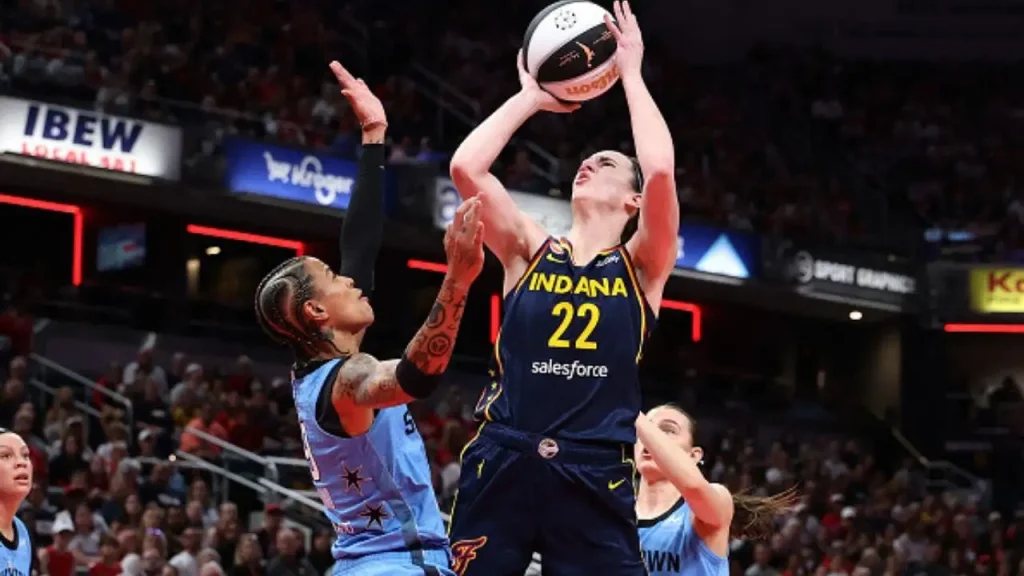 Caitlin Clark scores 32 points and records a double-double in Taylor Swift's Nikes while the Fever hold on through a surprising Sky comeback in overtime.
