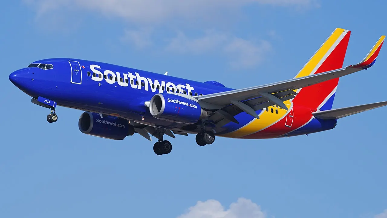 Daughter surprises her father, a Southwest Airlines captain, on his last flight