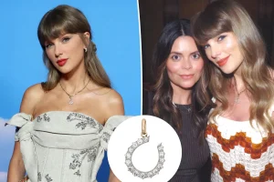 Details on Taylor Swift's horseshoe necklace frequently seen during her 'Toy Story 5' period