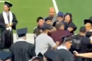 Disorder at California high school graduation as a violent fight erupts during the event