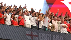 English soccer fan in large cowboy hat shares ideal review of Texas brisket before Croatia game
