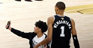 Fan Pauses Game 1 of NBA Finals to Take a Selfie with Victor Wembanyama
