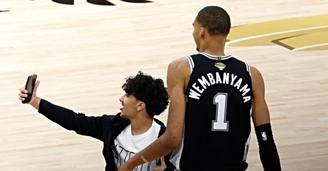 Fan Pauses Game 1 of NBA Finals to Take a Selfie with Victor Wembanyama