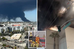 Fire department issues critical alert as thick smoke from warehouse fire in Boyle Heights blankets the city