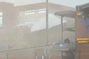 Five injured as strong winds sweep through a WVU baseball game, lifting tents into the air.