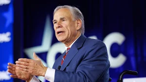 Greg Abbott shares an AI-generated image of himself dunking in a Spurs jersey to poke fun at Kathy Hochul following the Knicks mistake.