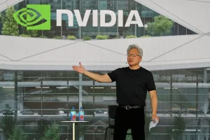 Huang from Nvidia promises that AI will enhance manufacturing jobs, with a trial taking place in Texas.