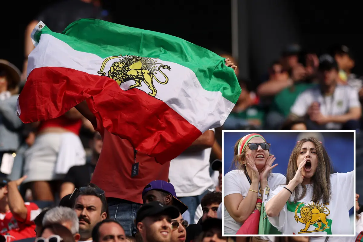 Iranian World Cup soccer fans display pre-revolutionary flag inside stadium despite FIFA prohibition