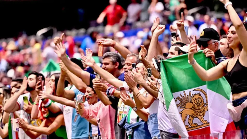 Iranian supporters fill SoFi Stadium with prohibited Lion-and-Sun flags despite FIFA's enforcement during the World Cup