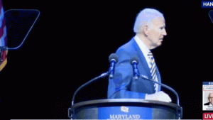 Joe Biden looks for guidance before leaving the stage at a Maryland event.