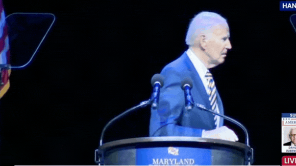 Joe Biden looks for guidance before leaving the stage at a Maryland event.