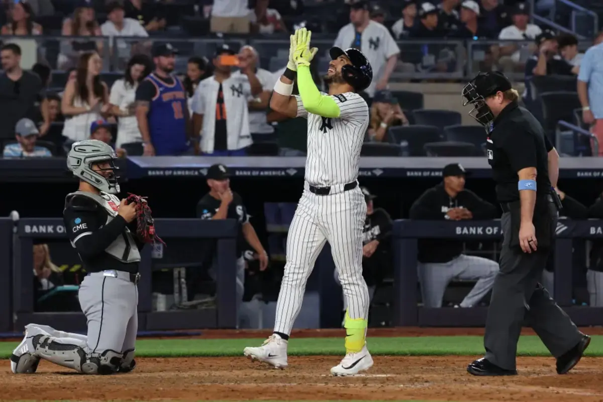 Jose Caballero of the Yankees looks for clarity on the pitch clock rule